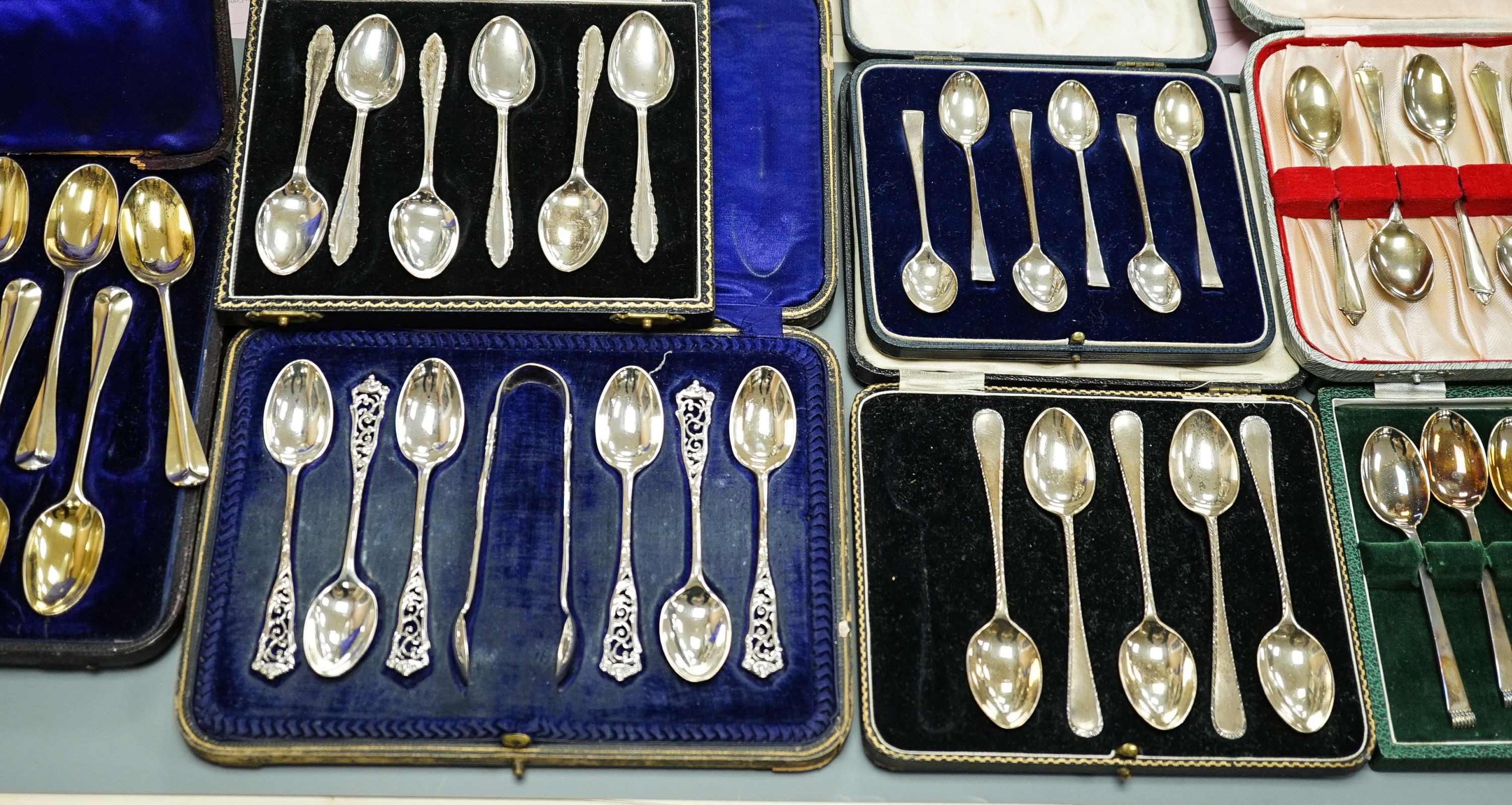 Seven assorted cased sets of English silver tea and coffee spoons, including a set of twelve silver gilt teaspoons, London, 1882 (one set incomplete).